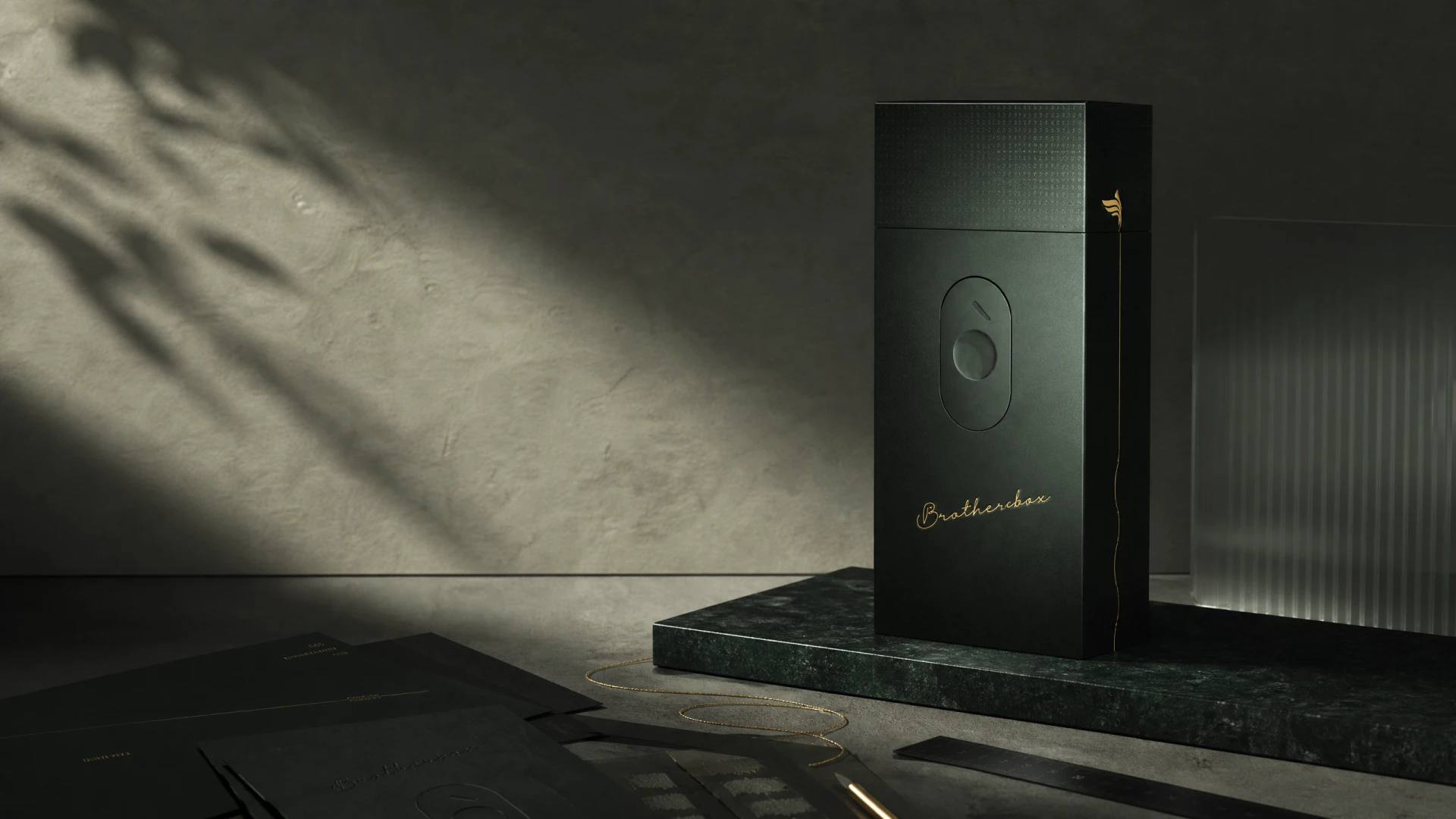 Dark‑green luxury tobacco packaging mock‑up with matching brand print collaterals, soft natural shadow scene