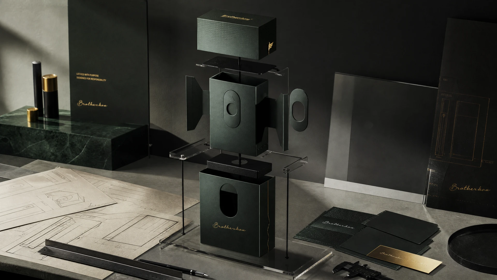 Exploded‑view display of drawer‑sliding packaging structure with transparent stand, design sketches and measuring tools on desktop